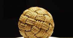 a ball of rope sitting on top of a table