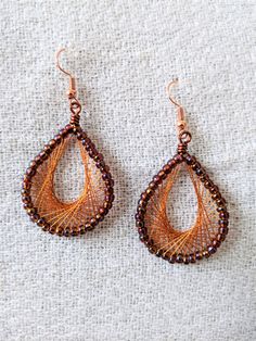 Handcrafted woven teardrop earrings, made with glass seed beads and embroidery thread. Total length from top of fishhook to bottom of teardrop is approximately 2.25". Earrings Purple, Glass Seed Beads, Fish Hook, Embroidery Thread, Teardrop Earrings, Seed Beads, Jewelry Earrings Dangle, Dangle Drop Earrings, Violet