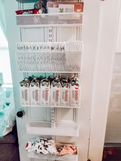 the door is open and there are many items on display in this closet, including shoes