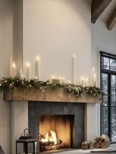 a living room with a fireplace decorated for christmas