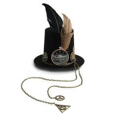 Don't underestimate this Mini Top Hat in a Dear Steampunk style. It will accompany any Victorian and steampunk outfit at your dressed-up or costumed events. Type: Mini hat Easy holding with integrated hair clips Material: polyester (durable, resistant, easy to wash and dry) Decoration: compass, feathers, and chains Want to add a touch of whimsy to your steampunk look? Check out our Steampunk Cat Ears Hat for a playful twist on classic style! Explore our full range of steampunk headwear for even Steampunk Hat For Themed Events, Steampunk Hat Halloween Costume Accessories, Steampunk Hat Costume Accessories For Halloween, Steampunk Hat For Halloween, Steampunk Mini Hats For Festivals, Steampunk Mini Hats For Halloween, Steampunk Adjustable Costume Hats And Headpieces, Steampunk Adjustable Hat For Costume Party, Vintage Mini Hat For Cosplay