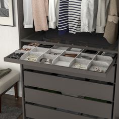 an organized closet with drawers and clothes hanging on the wall