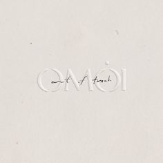 the word omoi is written in white paper with black ink on top and bottom