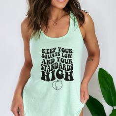 Super Soft and comfy Graphic Tank Top. Holds it shape after wash & Size up for more comfortable fit. Next LEvel Racerback tank. . . . . . . . . . . . . . . . . . . . . . . . . . . . . . . . . . . . . . . . . . : : S I Z E : : - For a standard fit, size up 1 - For an oversized fit, size up 2-3 - For a fitted shirt, size down. Great for knots, Tucks, or nice coverage with leggings. - Unisex Cut. works great for Everyone! : : D E T A I L S : : - Soft, Breathable, and comfy Next Level - Pre-shrunk f Green Cotton Tank Top For Gym, Comfortable Sleeveless Tank Top For Workout, Basic Relaxed Fit Tank Top For Workout, Green Athleisure Tank Top For Everyday, Comfortable Workout Tank Top, Funny Gym Shirts, Fitted Shirt, Workout Tank Top, Women Humor