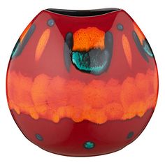 a red vase with orange and blue designs on it's sides, in front of a white background