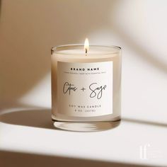 a candle that is sitting on a table with the words grace and sage in front of it