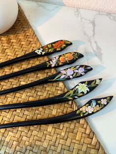 This is an order to make list, please allow 1 week before shipping. This exquisite hand-painted hairpin features traditional Chinese motifs of flowers and birds.  Crafted from pure natural ebony wood, the hairpin measures 18cm in length.  The intricate hand-painted designs are detailed and have a pearl-like luster. The listed price is for one hairpin, and it comes in various patterns to choose from.  Unique gift you can choose for yourself, or your family and friends :-) Chinese Motifs, Chinese Hairpin, Japanese Lacquerware, Painted Designs, Hair Fork, Hair Stick, Ebony Wood, Hair Painting, Hair Sticks