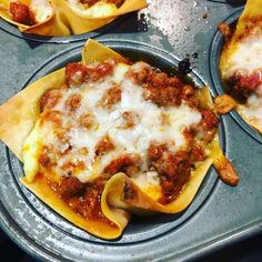 some taco shells are sitting on a pan