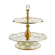 three tiered glass cake stand with gold trimmings and an acrylic design