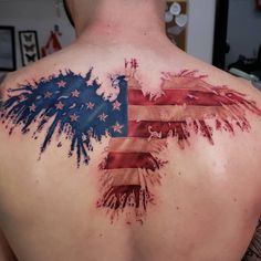 an american flag tattoo on the back of a man