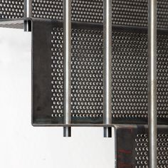 a close up view of metal bars on a wall