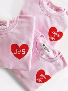 "HEART U MOST.... in pink! 💗 a cozy sweatshirt, personalized just for you with names of your choice in a stamped vinyl heart. All letters are CAPITAL. Please follow the directions in the personalization box regarding the \"&\" symbol. Examples are shown in the listing photos. **Two words or initials can be separated with \"&\" -- please make sure you include the \"&\" sign where you would like it placed between the two words or names. If you leave out the \"&\" we will not inclu Customizable Crew Neck Tops For Valentine's Day, Personalized Pink Crew Neck Sweatshirt, Personalized Long Sleeve Tops With Custom Text, Customizable Long Sleeve Pink Sweatshirt, Valentine's Day Pink Relaxed Fit Top, Customizable Pink Cotton Sweatshirt, Pink Heart Graphic Crew Neck Sweatshirt, Pink Long Sleeve Sweatshirt With Heart Graphic, Pink Long Sleeve T-shirt With Heart Graphic