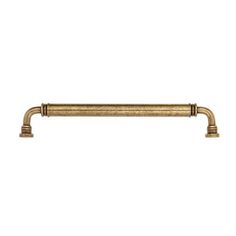 an antique brass cabinet handle on a white background