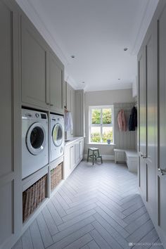 a washer and dryer in a white laundry room