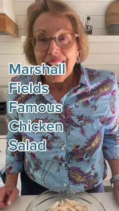 a woman is making pasta in her kitchen with the words marshall fields famous chicken salad