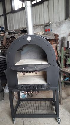 an outdoor pizza oven in a garage