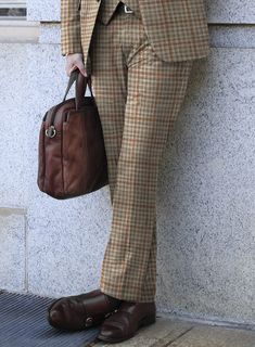 A nod to your profound fashion sense is our Loro Piana Abama Wool Silk Pants, which present themselves as elegant couture. Tailored with a wool-blended fabric, our pants have an exquisite look in the form of a checks pattern with different shades of brown hue that helps you transform into a royal personality. In addition to the fabric's gentle and light touch, these pairs give your formal wear a stylish twist and comfort at the highest peak. So obtain perfection with this piece that will stay in Luxurious Brands, Elegant Couture, Checks Pattern, Flannel Suit, Flannel Pants, Green Suit, Silk Suit, Light Touch, Button Jacket