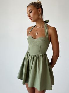 Mini dress Halter neck tie fastening  Stitched bust  Invisible zip fastening at back  Gathered waist Sage Green Dress, Dress Sage, Sage Dress, Brunch Dress, Polly Dress, Dress Halter, Green Mini Dress, Invisible Zip, Buy Now Pay Later