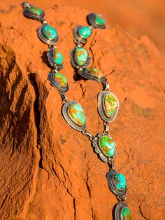 One of my favorite items to shoot. These necklaces showcase Royston turquoise, the most beautiful mix of ocean blue, forest greens and brilliant copper. The Artist link features 3 to 4 different bezel and concho design. They are all one of a kind and a custom order. I do layouts and include you in the process! Our stones are second to none, we go direct to the mine to choose. All of our Royston stones are hand-picked to create a unique, heirloom quality piece that you will enjoy for years to come. Prices may vary depending on stone size, so please contact us for specifics! I would love to design one just for you! Southwestern Multi-stone Green Jewelry, Southwestern Green Multi-stone Jewelry, Southwestern Style Green Multi-stone Jewelry, One Of A Kind Southwestern Green Necklace, Unique Southwestern Green Necklace, Southwestern Green Necklace, Southwestern Turquoise Cabochon Necklace, Western Turquoise Jewelry With Patina, Green Western Style Jewelry For Gift