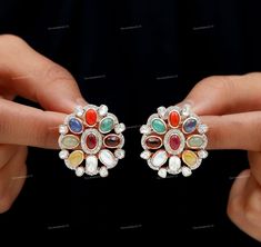 Multi Gemstone Stud Earring, 925 Sterling Silver, Rose Gold Earring, Polki Jewelry, Diamond Stud, Wedding Stud Earring, Gift For Wife Manufacture Country : India * Customization always available for Ring size, metal selection and any type of center stones changes, etc.... * If you want to make your own idea of Jewelry we can do it. Material : 925 Sterling Silver Main Stone : Ruby Secondary Gemstone : Tanzanite, Opal, Coral, Garnet, Polki, Diamond Gemstone Color :  Gemstone Shape : As Seen In A P Multicolor Diamond Round Earrings, Multicolor Round Diamond Earrings, White Diamond Multi-stone Earrings, White Gold Multi-stone Earrings For Wedding, White Gold Multi-stone Wedding Earrings, White Multi-stone Earrings Fine Jewelry, Diamond Multi-stone Earrings For Anniversary, Multi-stone Cubic Zirconia Earrings For Anniversary, Gift Jewelry With Multicolor Rose Cut Diamonds