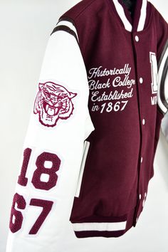 Harkening back to a timeless symbol of school spirit and HBCU style, the 3.0 Varsity Jacket is a true representation of LegacyHistoryPride. This classic silhouette features details on the sleeves depicting the LHP Elements, while the jacket highlights the school mascot, year of establishment, and school motto, proudly displaying school pride with a sporty flair. Expertly constructed of wool and leather, it is finished with striped ribbed trim and LHP lining. The LHP Elements: “The DRUM” – Repres Morehouse College, Tiger Mascot, College Visit, Timeless Symbol, Leather Sleeves, School Pride, School Mascot, Leather Sleeve, The Tiger