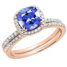 a tan and white gold ring set with an oval blue sapphire surrounded by diamonds