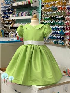 "Features: -This dress features Polyester Silk Dupioni Green Apple and is coordinated with White -This dress is made with Polyester Silk Dupioni fabric the best quality of a Polyester Silk Dupioni I've worked with in over 40 years of sewing. All the beauty without the cost. This Dress can be made out of Real Dupioni for an additional price -- Or Real Silk can be mailed in. Contact me for more information -The dress has an invisible zipper in the back. -- The Dress will be fully lined including t Green Apple Wedding, Apple Wedding, Pageant Wear, Silk Dupioni, Tea Party Dress, Wedding Flower Girl Dresses, Wedding Flower Girl, Birthday Party Dress, Kids Outfits Girls