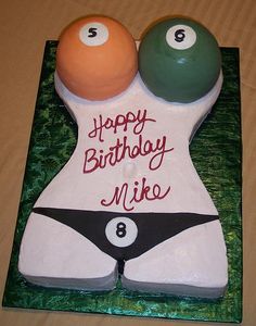 two pool balls on top of a birthday cake