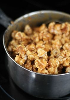 a metal pan filled with cereal on top of a stove