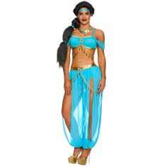 a woman in a blue and gold belly dance costume with feathers on her head, holding a black bird