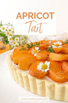 an apricot tart with flowers on top and the words apricot tart above it