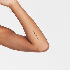 a woman's arm with writing on it