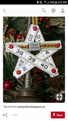 a christmas ornament that has been made to look like a star with measuring tape on it