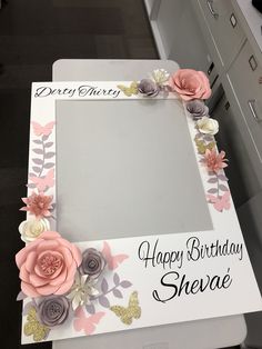 a birthday photo frame with flowers on it