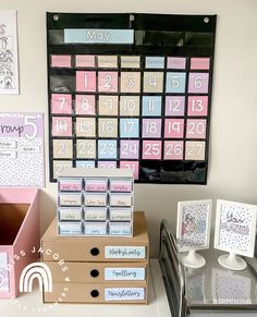 a desk with several boxes and calendars on it