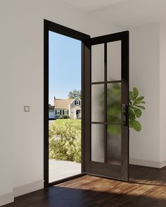 an open door in the middle of a room with wood flooring and white walls