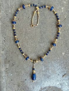 Made of gold-plated filigree findings and lapis lazuli stone, this necklace looks striking in sunlight!  Necklace is 20in.this can come with earrings to match! Gold Lapis Lazuli Spiritual Necklace, Bohemian Gold Lapis Lazuli Necklace, Gold Bohemian Jewelry With Lapis Lazuli, Gold Bohemian Lapis Lazuli Jewelry, Bohemian Gold Lapis Lazuli Jewelry, Gold Lapis Lazuli Necklaces For Jewelry Making, Gold Necklaces With Lapis Lazuli Gemstone Beads, Gold Lapis Lazuli Necklace With Gemstone Beads, Elegant Gold Beaded Necklaces With Lapis Lazuli