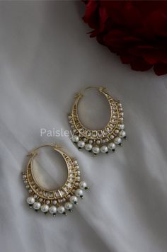 The chandbali hoops are handcrafted by the artisans of India to create a perfect romance between classic and modern concepts of Indian jewelry. The beautiful work of art made in 22K gold plating in a melange of high-grade kundan and pearls transcends the boundary of age and time that speak the language of opulence. Add this traditional Indian bridal beauty to your jewelry wardrobe and make it your companion for your special days. Earrings Length - 7 cm Closure - Lever Back Style Tip - A perfect Luxury Chandbali Necklaces For Festivals, Traditional Jewelry Stone, Luxury Chandbali Lehenga For Traditional Ceremonies, Handmade Luxury Chandbali Jewelry Sets, Luxury Chandbali Necklaces, Luxury Chandbali Choker For Diwali, Luxury Elegant Chandbali Bangle, Luxury Bollywood Chandbalis With Hand Set Details, Cheap Traditional Earrings For Summer