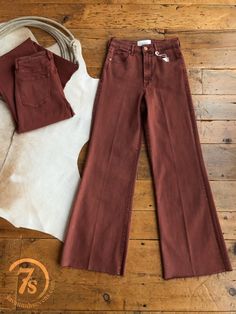 Cranberry denim wide leg jean. Raw cut hem. Tailored center inseam press. Antiqued copper hardware. Fitted through the waist and hips; relaxed wide leg fit from the thighs down. Straight cut waist, not hour glass. 11.5" high rise, based on a size 28. Rise will be slightly lower for smaller sizes and slightly higher for Wide Leg Brown Flare Jeans For Work, Brown Wide Leg Work Jeans, Brown Wide Leg Jeans For Work, Chic Wide Leg Brown Jeans, Chic Brown Wide Leg Jeans, Chic Flares With Frayed Hem For Fall, High Rise Cotton Flares For Fall, Chic Brown Wide Leg Flare Jeans, Chic Cropped Wide-leg Jeans For Fall