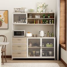 a kitchen area with a microwave, counter top and shelves filled with food on it