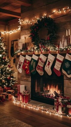 christmas stockings hung over a fireplace with presents under them