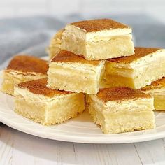 several pieces of cake sitting on top of a white plate