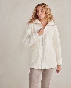 Wrap yourself in the embrace of the Ann Taylor Haven Well Within Sherpa Zip Jacket, where comfort meets sustainable chic. This ivory sherpa jacket is a must-have for those who value both style and environmental consciousness.

- **Size**: Large
- **Color**: Ivory
- **Material**: 100% Recycled Polyester
- **Gender**: Female
- **Fit**: Relaxed
- **Length**: 28 1/2 inches
- **Features**: Long sleeves, on-seam pockets, full-zip style, foldover collar
- **Care**: Machine washable

Designed for the mo Cozy Snug Outerwear For Loungewear, Snug Cozy Loungewear Outerwear, Comfortable Soft Outerwear For Loungewear, Soft Texture Outerwear For Loungewear, Cozy Snug Outerwear With Soft Texture, Cozy Winter White Fleece Jacket, Cozy Fall Outerwear For Relaxation, Cozy White Outerwear For Loungewear, Cozy Fit White Outerwear With Soft Texture