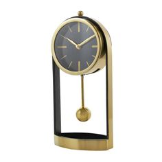 a black and gold clock on a stand with a ball in the middle, against a white background