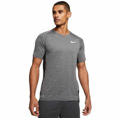 Brand new with tags! Men's Nike Victory Slim Fit Shirt The Nike Top has mesh panels in high-heat areas for cooling comfort when you're going all out. The slim-fitting design can be worn on its own or as a lightweight, sweat-wicking layer.   Dri-FIT technology wicks sweat to help you stay dry and comfortable. Mesh panels in high-heat areas on the sides and upper back let cool air in and excess heat out. Slim fit for a tailored feel Curved hem back hem 92% recycled polyester/8% spandex Machine was Nike Top, Training Tops, Slim Fit Shirt, Active Wear Tops, Nike Tops, Men's Nike, Men Short Sleeve, Dri Fit, Victorious