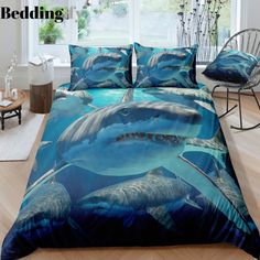 a bed with two dolphins on it in front of a window