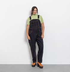 Vintage 90's black denim overalls. Denim dreams really do come true! Classic jean overalls. Medium/light weight soft denim. Contrasting yellow stitching. In great condition with almost no signs of wear. Well laundered and ready to wear. Colors may vary from screen to screen. Over-dyed black by us.  Material: Denim (100% Cotton) Best Fit: Extra Large Size On Tag: 20 Brand: St John's Bay / Made In Hong Kong Sizing Bust: Open Shoulder To Bottom:  59.5" (Adjustable) Hips (Double / Measured Flat):   24" Middle Band (Double / Measured Flat):   21.5" Inseam:  29" Thigh (Double / Measured Flat):  15.5" Ankle (Measured Flat / Double):  9.25" For reference the model measures: Height 5'9" / Waist  33" / Hips  43" /  Overalls fit the model as shown, not pinned on model. Measured with overalls lying fl Overalls Fit, Overalls White, Dreams Really Do Come True, Womens Overalls, Black Denim Overalls, Overalls Denim, Jean Overalls, Classic Jeans, Overalls Women