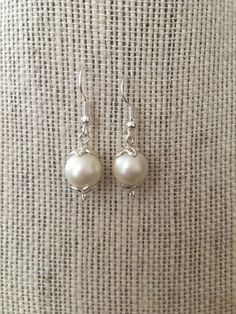 These dainty cuties are adorable. The pearls are decorated with silver bead caps.  They are so pretty and would help to dress up so many outfits Wood Hoop Earrings, Boho Hoop Earrings, Lapis Jewelry, Gemstone Hoop Earrings, Daisy Earrings, Red Earrings, Large Hoop Earrings, Beaded Hoop Earrings, Silver Bead