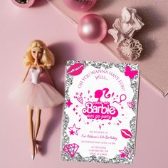 a barbie doll next to a pink and silver birthday party card on a pink background