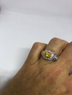 Vintage Golden Citrine Ring Deco 925 Sterling Silver Unusual cut of citrine surrounded by white sapphire Sterling Filigree finished Setting Handmade Size 7 Can be resized by my jeweler for a $10-$20 jeweler's fee All rings are shipped free in the US in a nice gift box. Check out our over a THOUSAND great reviews Engraving is $4 per letter and is not always perfect depending on the piece. It can take a few days if the jeweler is busy. This is payable to Paypal Judithsltd@gmail.com White Gold Citrine Jewelry With Center Stone, Fine Jewelry: Silver Yellow Sapphire, Fine Jewelry Silver Yellow Sapphire Jewelry, White Gold Citrine Jewelry With Accent Stones, Silver Yellow Sapphire Jewelry For Anniversary, Silver Jewelry With Yellow Sapphire For Anniversary, Silver Yellow Sapphire Ring In Fine Jewelry Style, Silver Yellow Sapphire Fine Jewelry Ring, Oval Yellow Sapphire Jewelry With Prong Setting